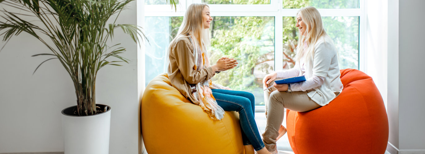 Young woman with senior female psychologist